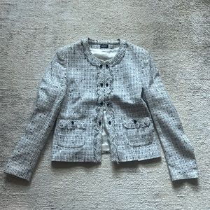 European designer tweed ruffle button detail